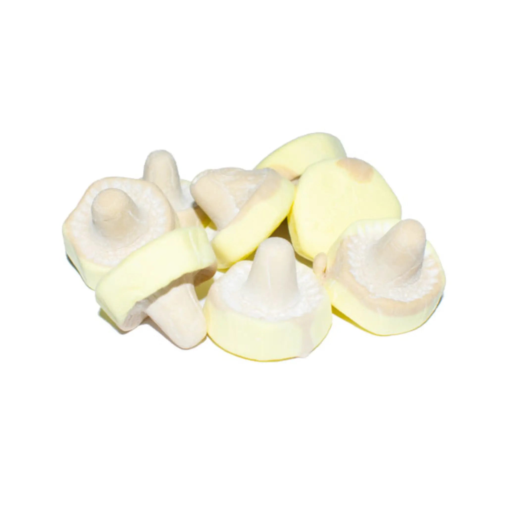 Eight pieces of Swedish candy shaped like mushrooms, in pastel yellow, white and brown.