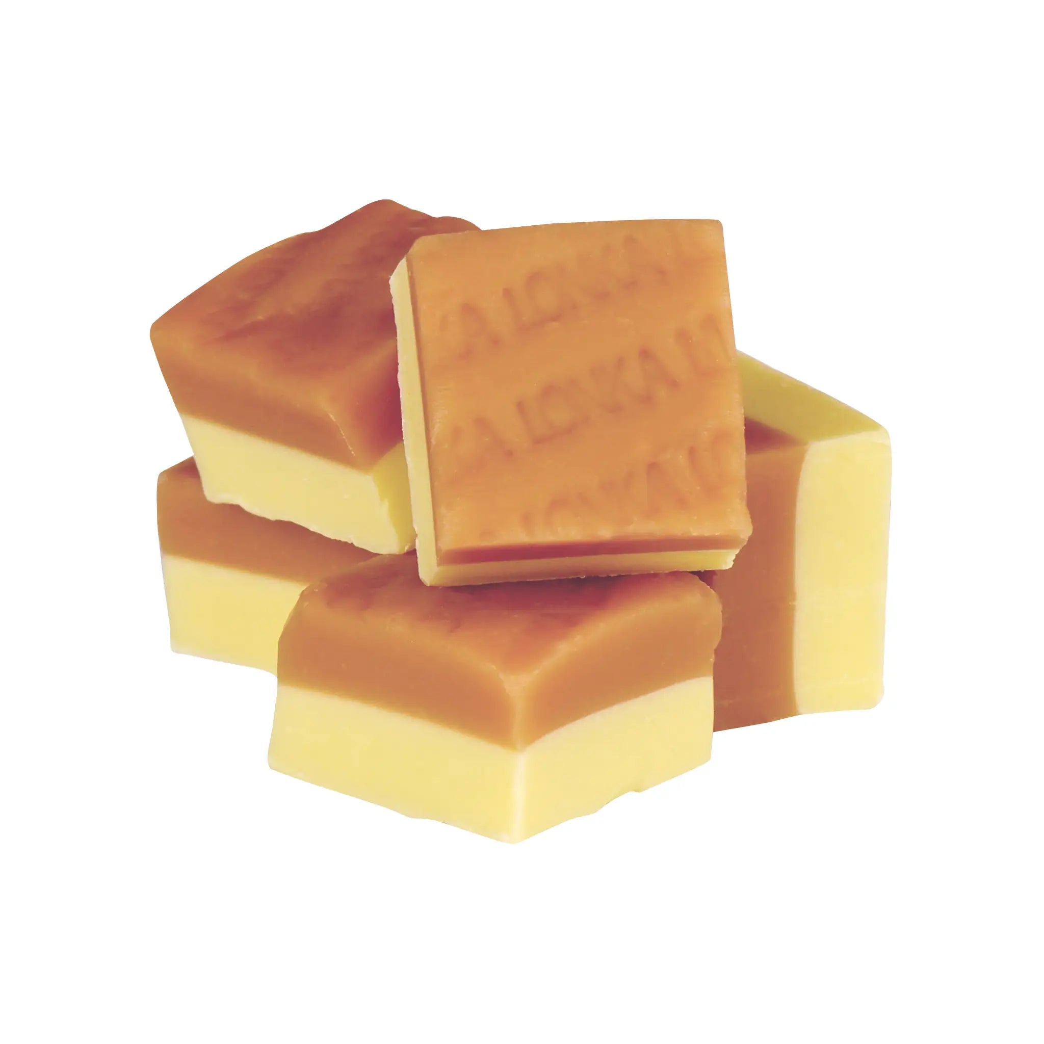 Square pieces of Swedish candy in brown and yellow.