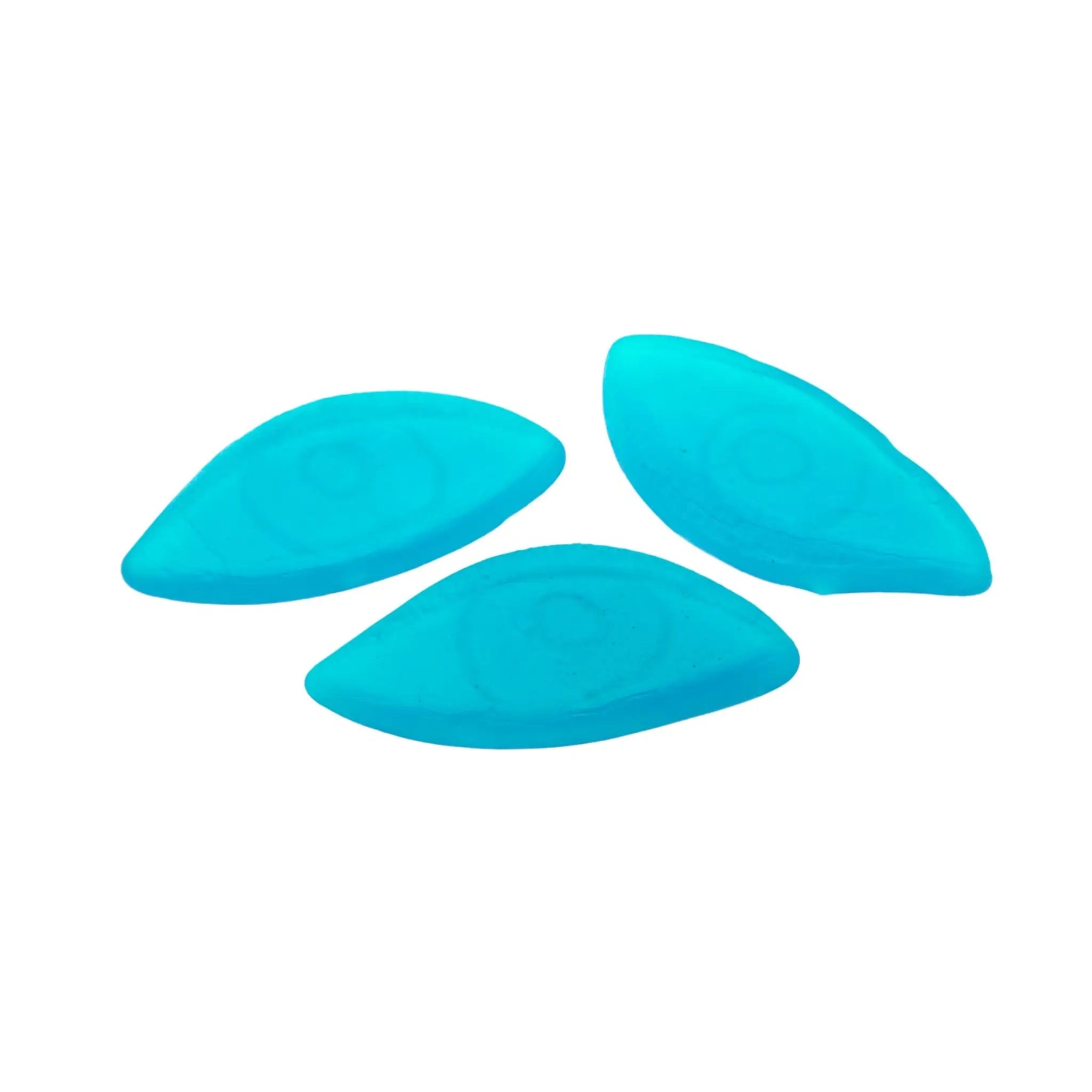 Three pieces of Swedish candy in blue, in the shape of eyes.