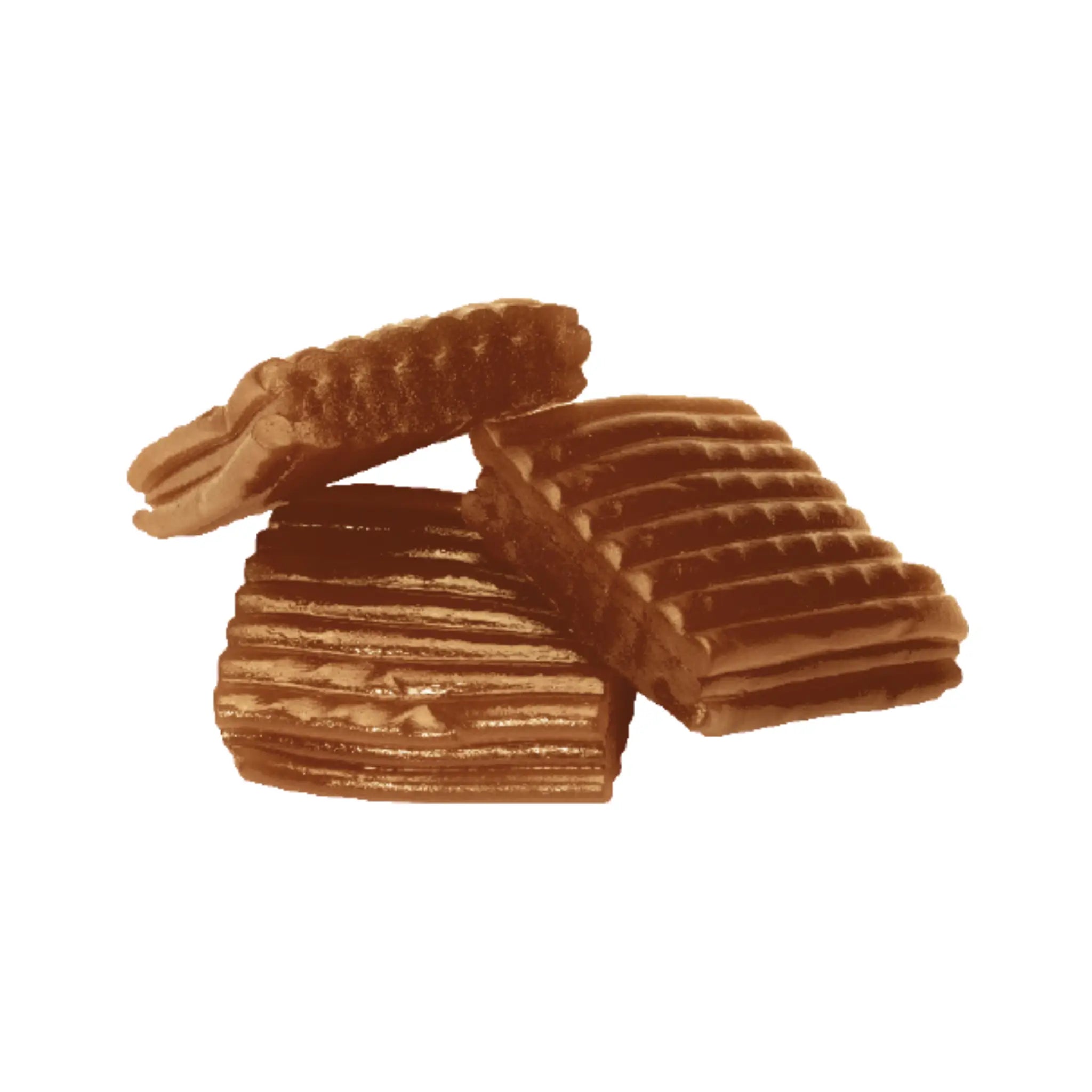 Three brown pieces of Swedish candy shaped like carpets.