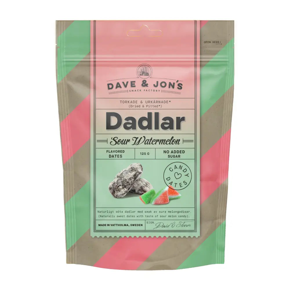 A beige back with pink and green stripes, filled with dates with the word "Dadlar" in the front over a picture of watermelon pieces and dates.