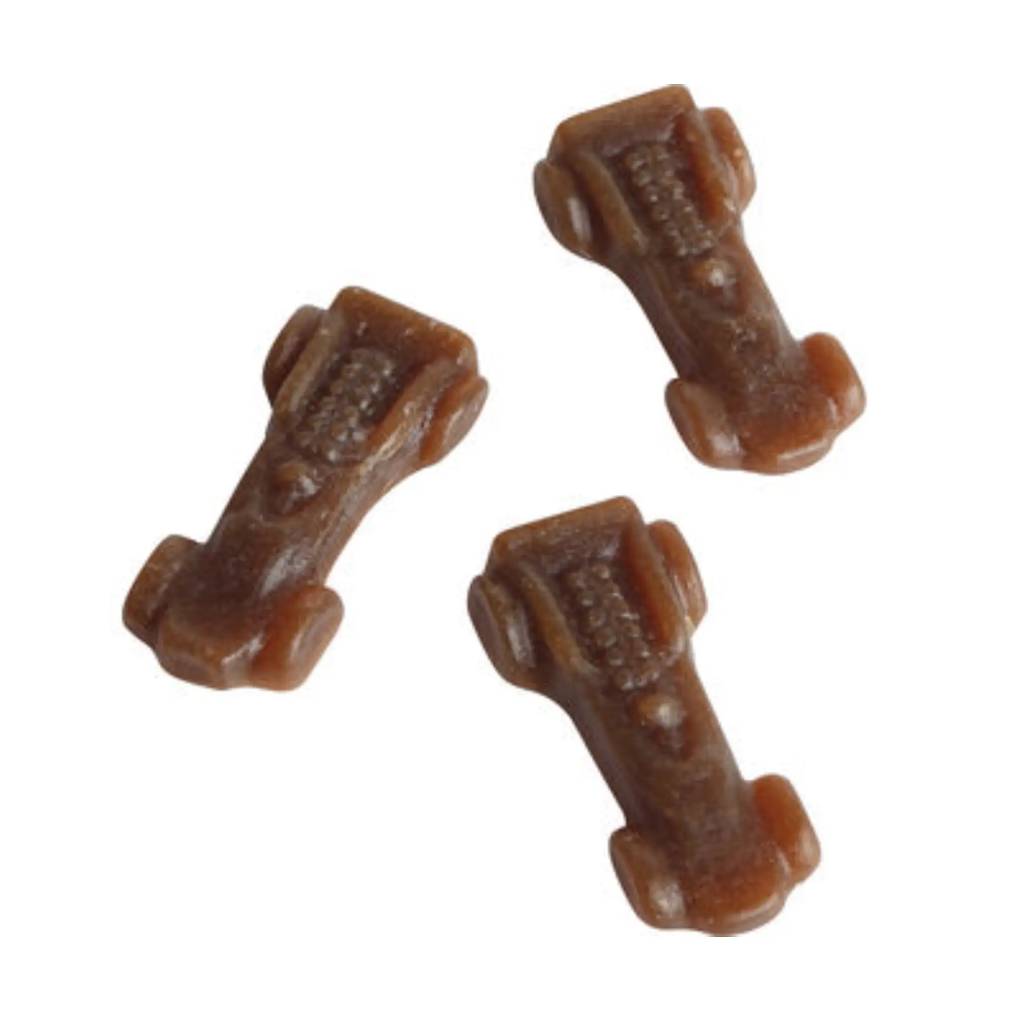Three brown pieces of Swedish candy, in the shape of Ferrari cars.