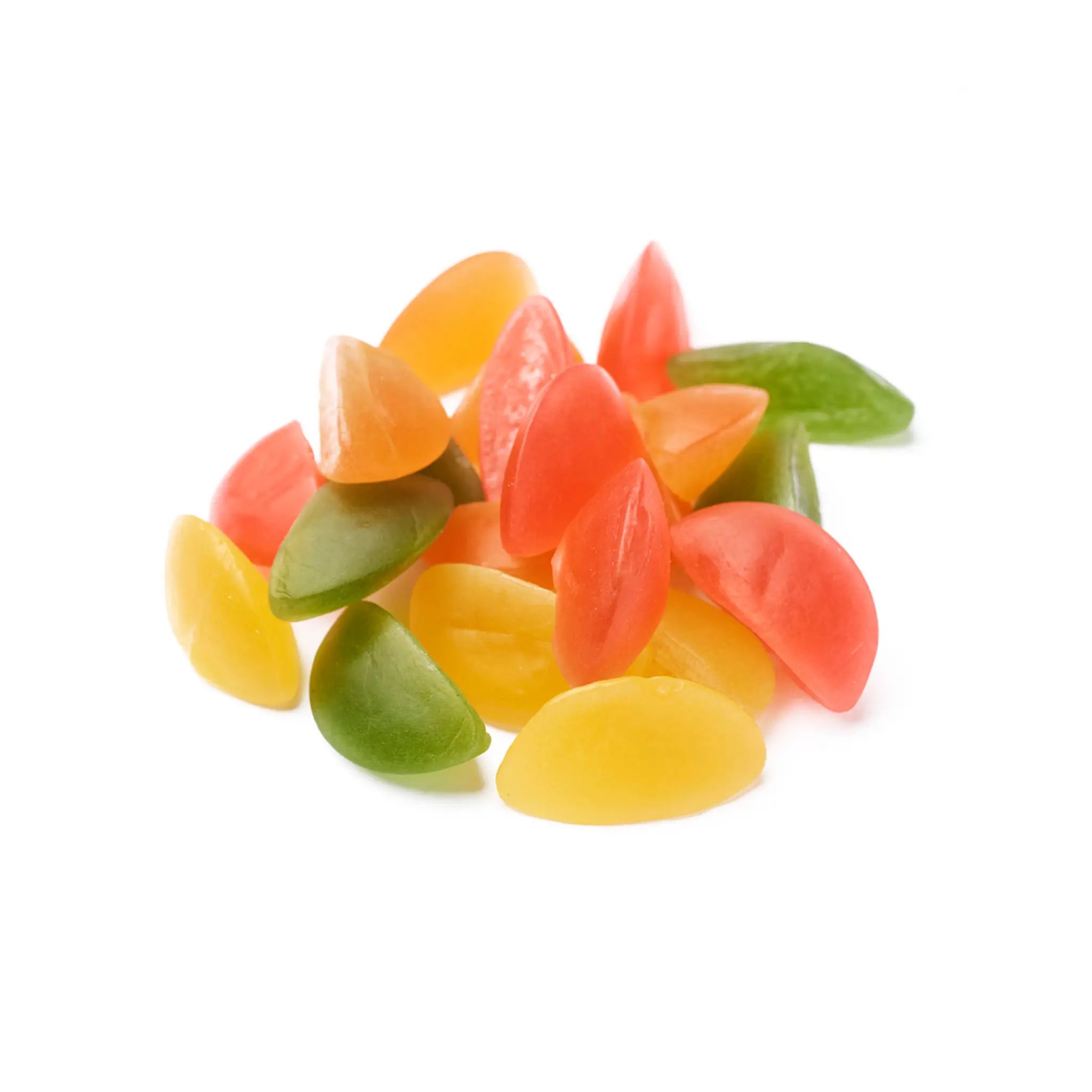 Multiple pieces of Swedish candy in the shape of boats in red, orange, yellow and green.