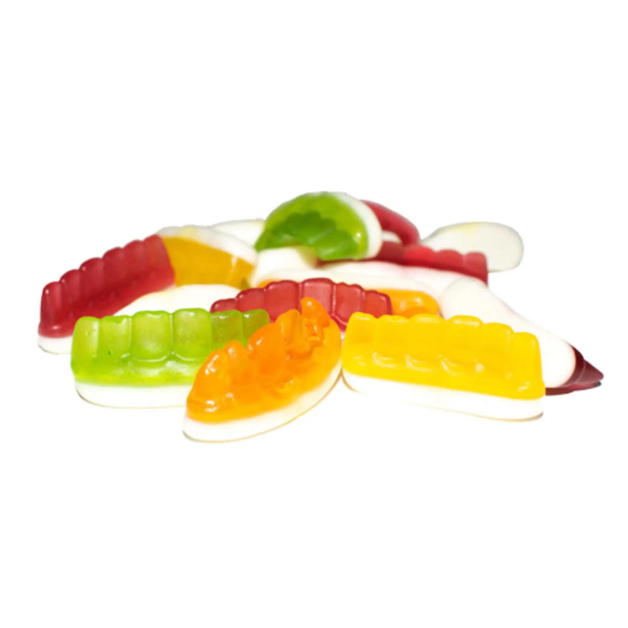 Multiple pieces of candy in the shape of teeth in green, red, orange and yellow with a bit of white.