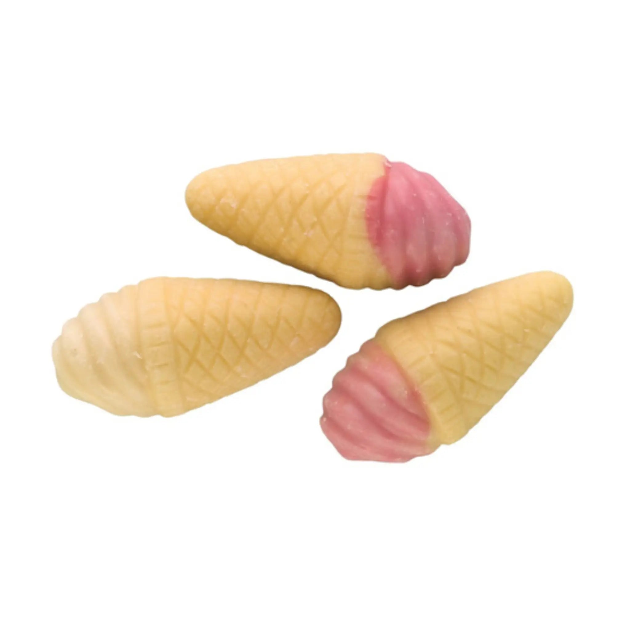 Three pieces of Swedish candy in the shape of ice creams in pink, white and beige.