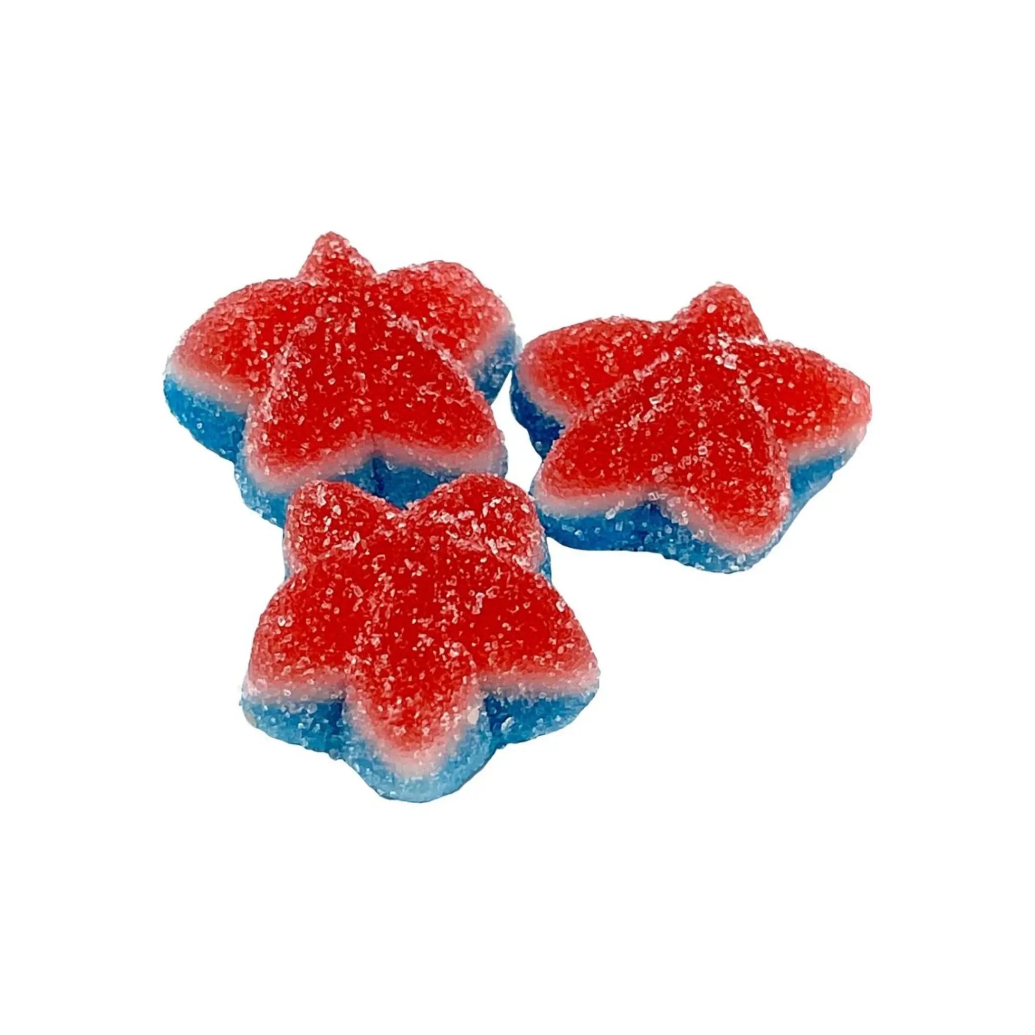 Three pieces of candy shaped like stars, with red on the top, white in the middle and blue at the bottom, all coated in sugar.