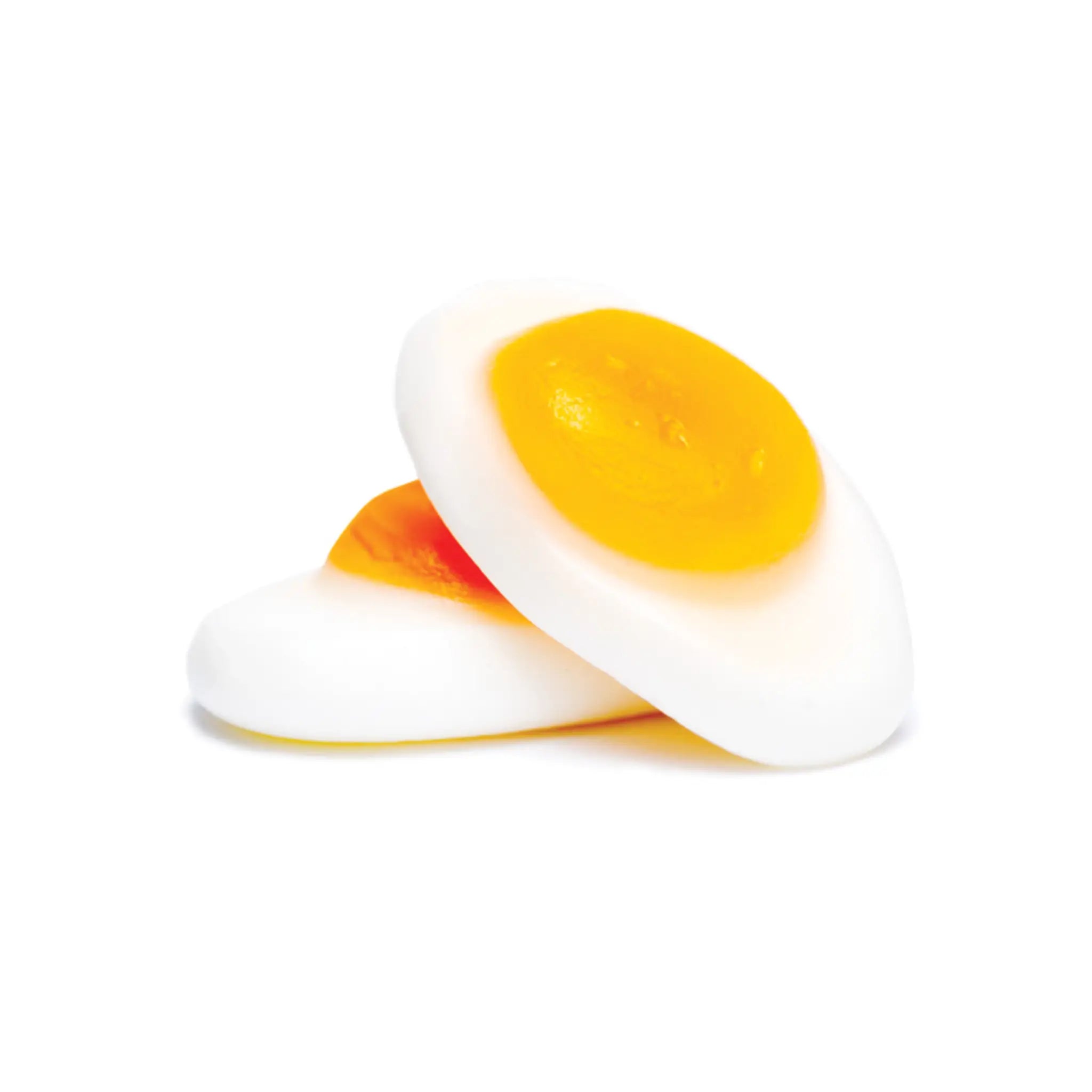 Two pieces of Swedish candy in the shape of fried eggs in yellow and white.