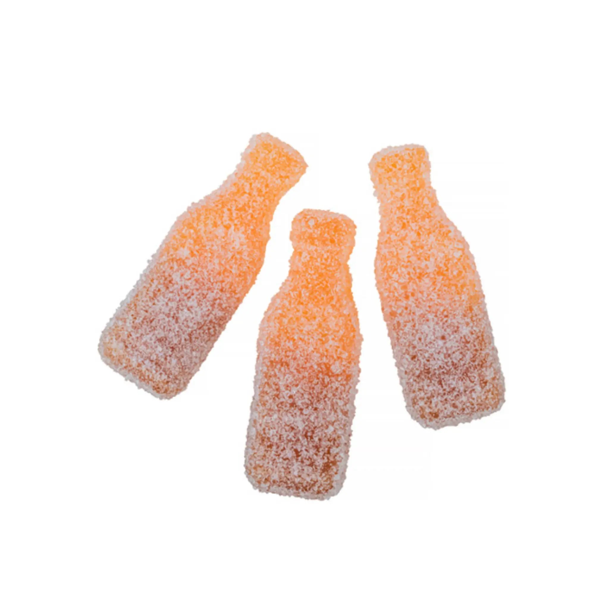 Three pieces of Swedish candy shaped like bottles in orange and brown, coated in sugar.