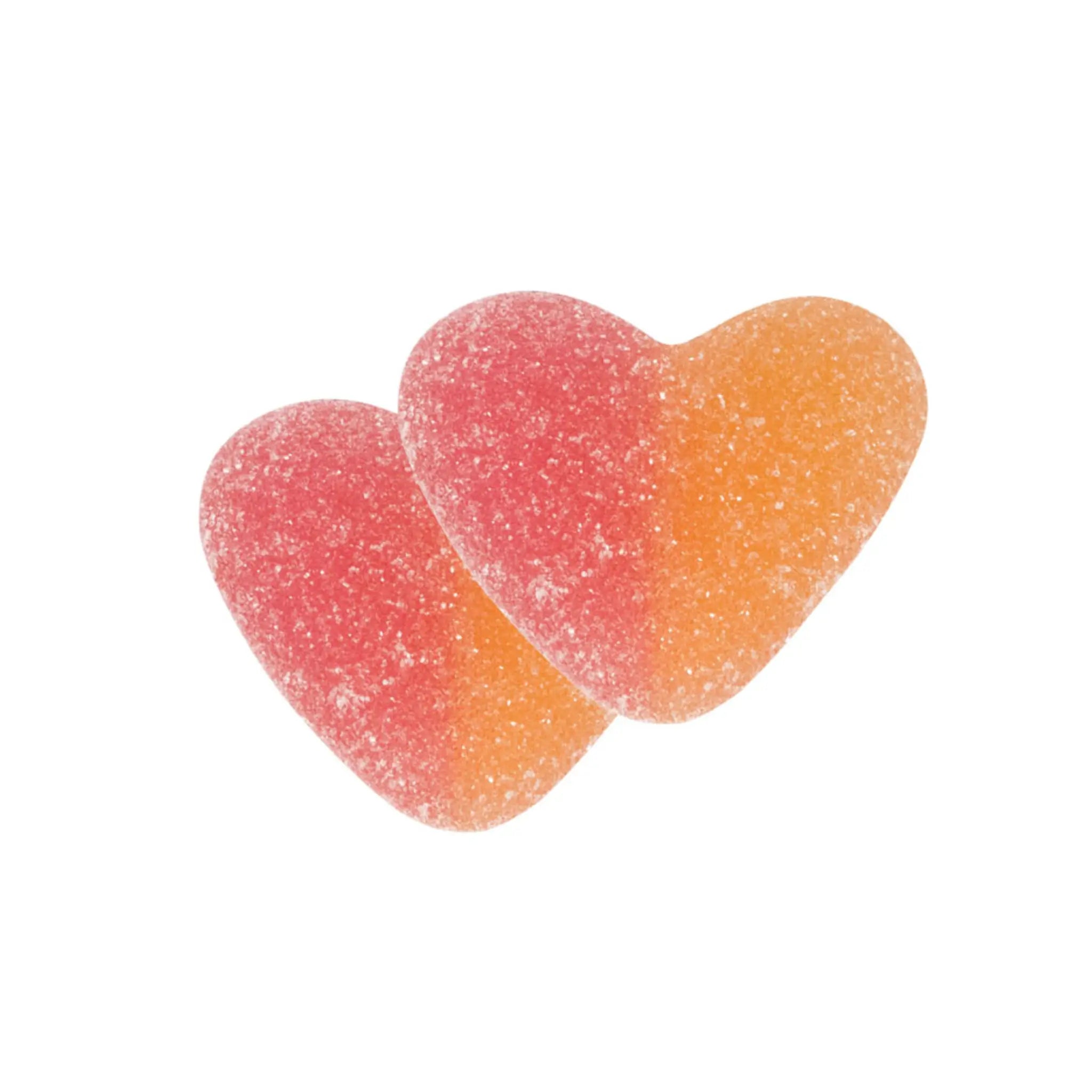 Two pieces of Swedish candy in the shape of hearts, pink on the left side and orange on the right side, coated in sugar.