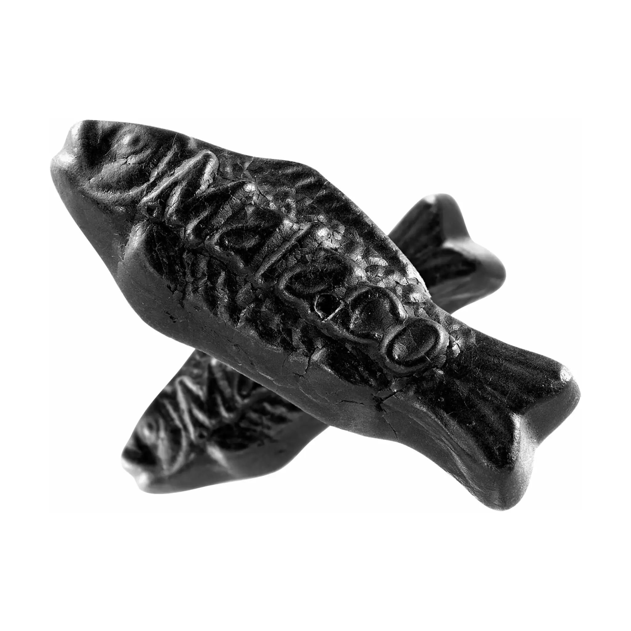 Swedish candy in the shape of black fish with the text "Malaco" on top.