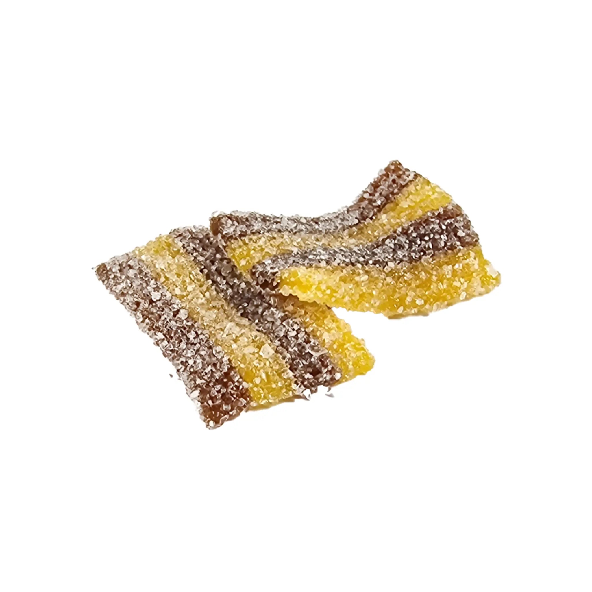 Two pieces of candy shaped like carpets in yellow and brown stripes, coated in sugar.