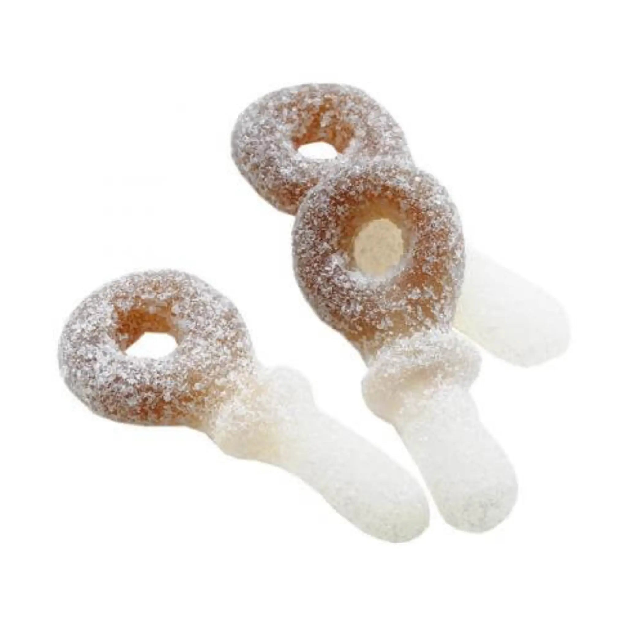 Three pieces of Swedish candy in brown and white, coated in sugar, and in the shape of pacifiers.