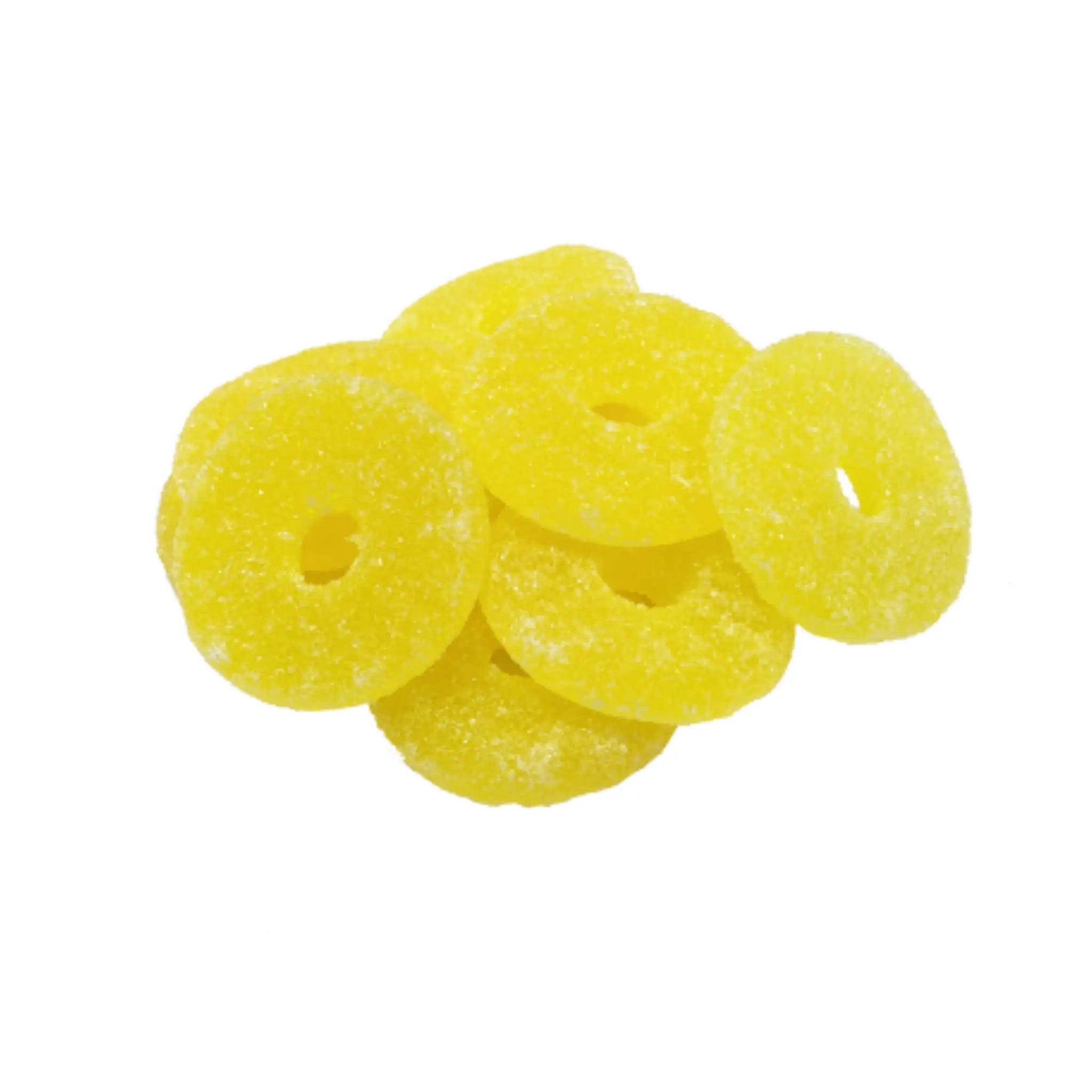 Multiple pieces of Swedish candy in the shape of pineapple rings, in yellow, and coated in sugar.