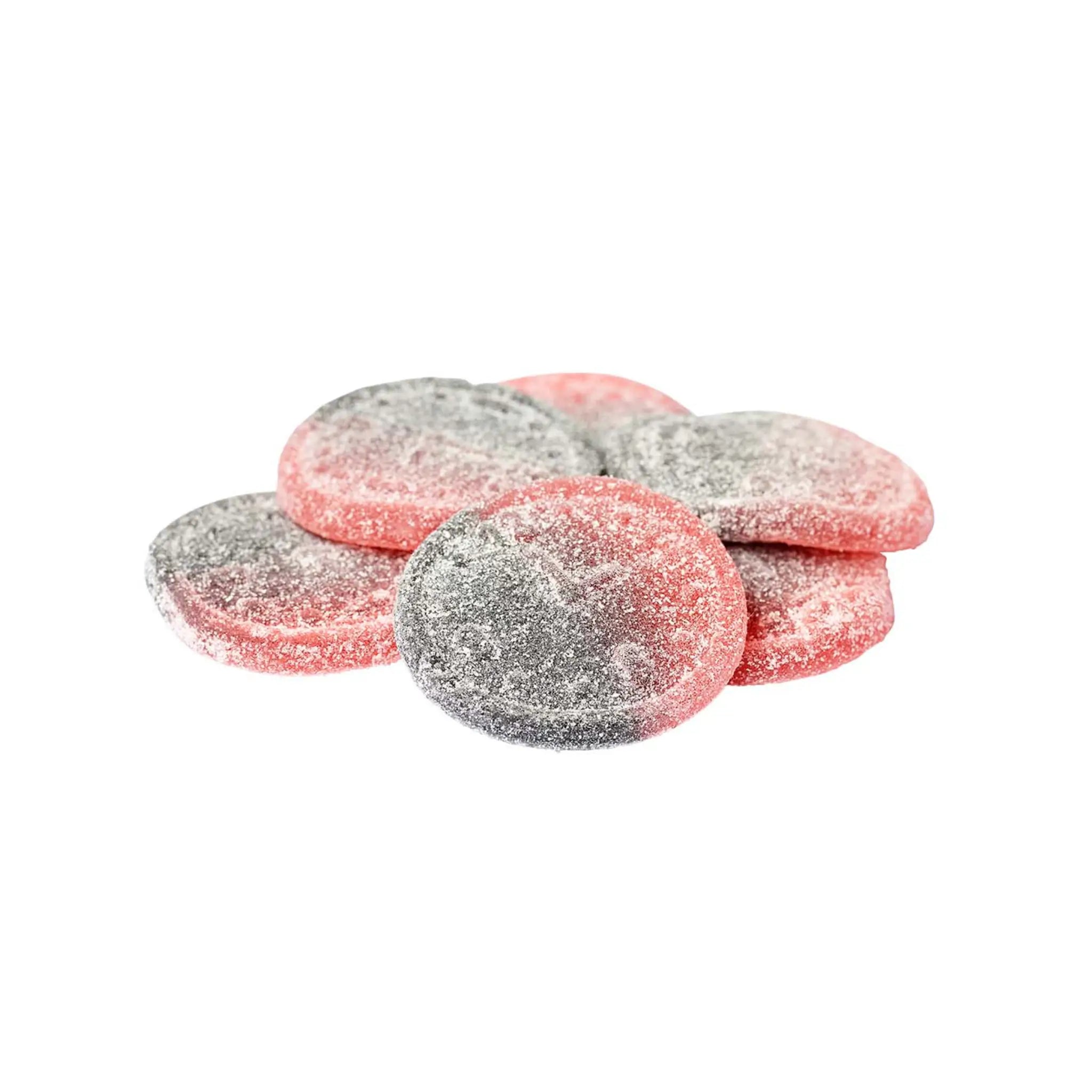 Multiple pieces of Swedish candy in the shape of circles, half red and half black, coated in sugar.