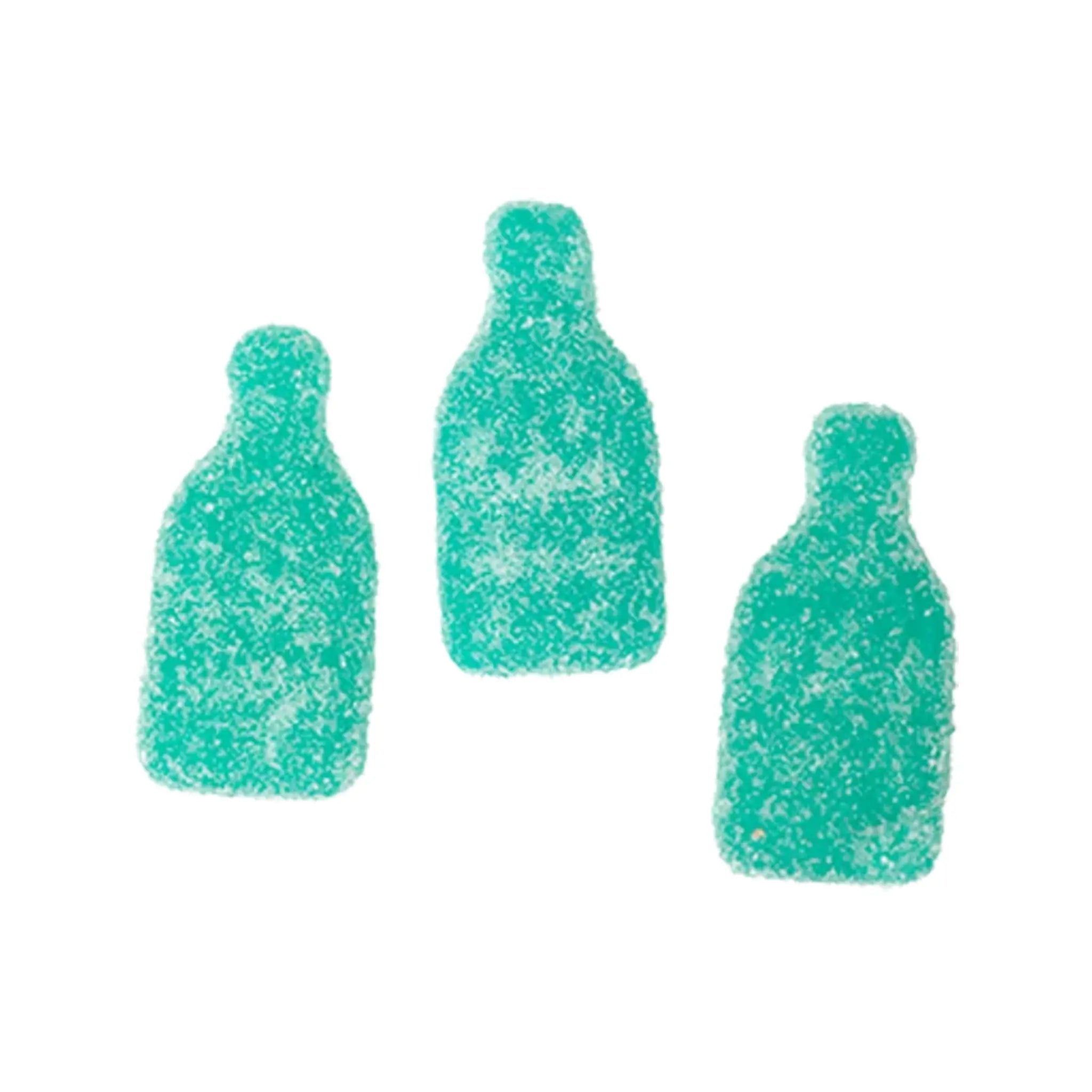 Three blue pieces of Swedish candy in the shape of bottles, coated in sugar.