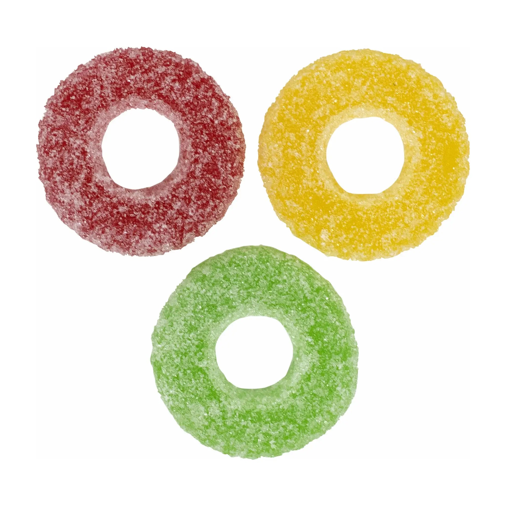 Three Swedish candy pieces in the shape of wheels in red, yellow and green, coated in sugar.