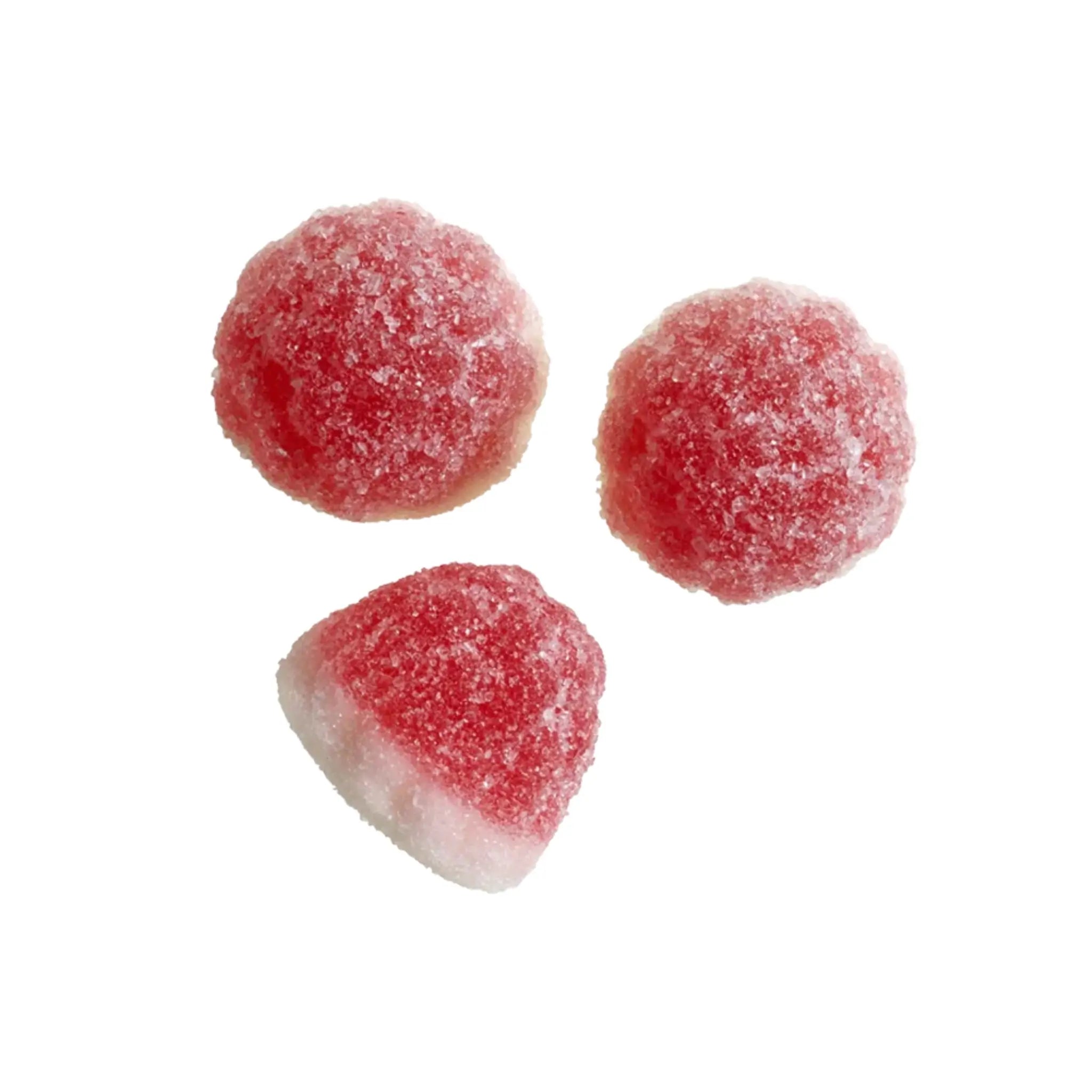 Three pieces of Swedish candy in the shape of little pieces in pink, with a white bottom, coated in sugar.