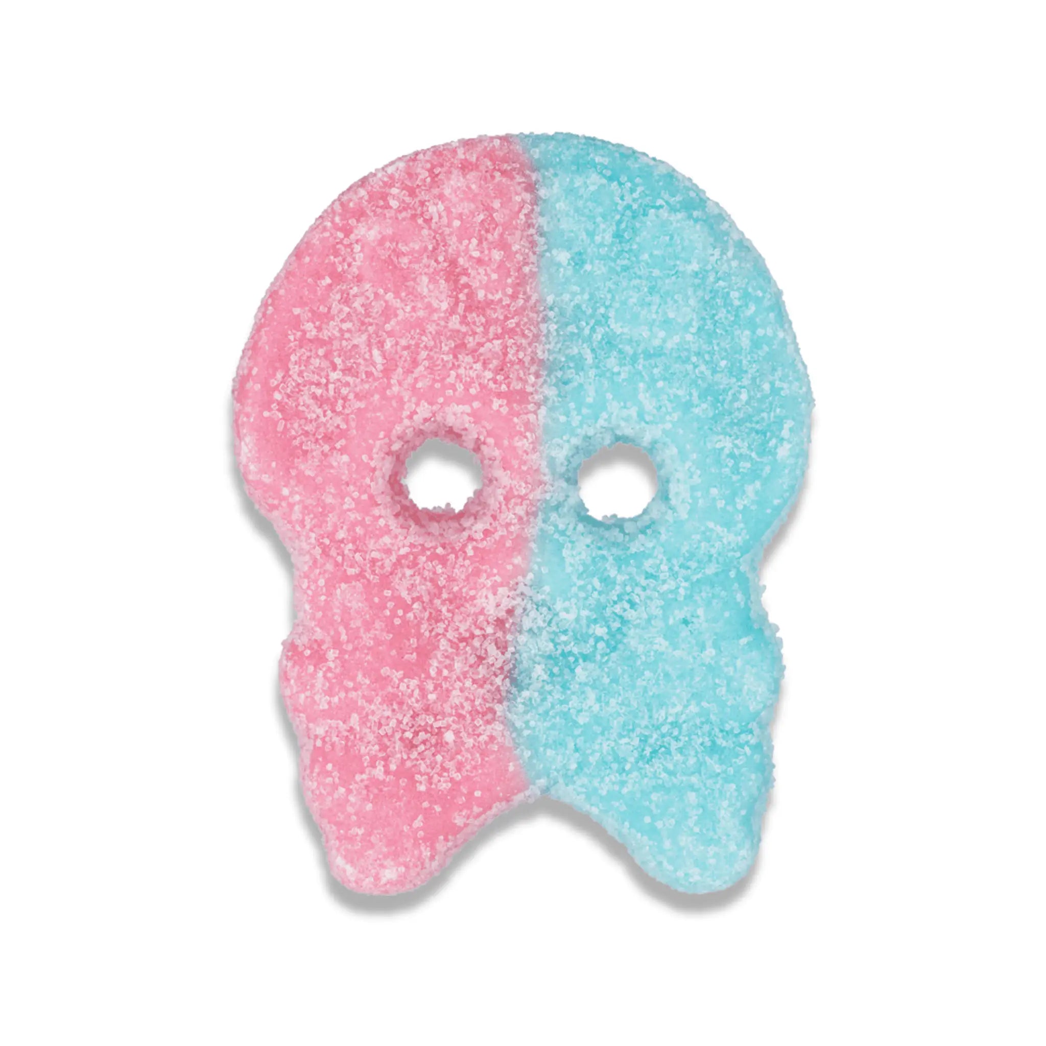 A piece of Swedish candy in the shape of a a pink and blue skull, covered in sugar.