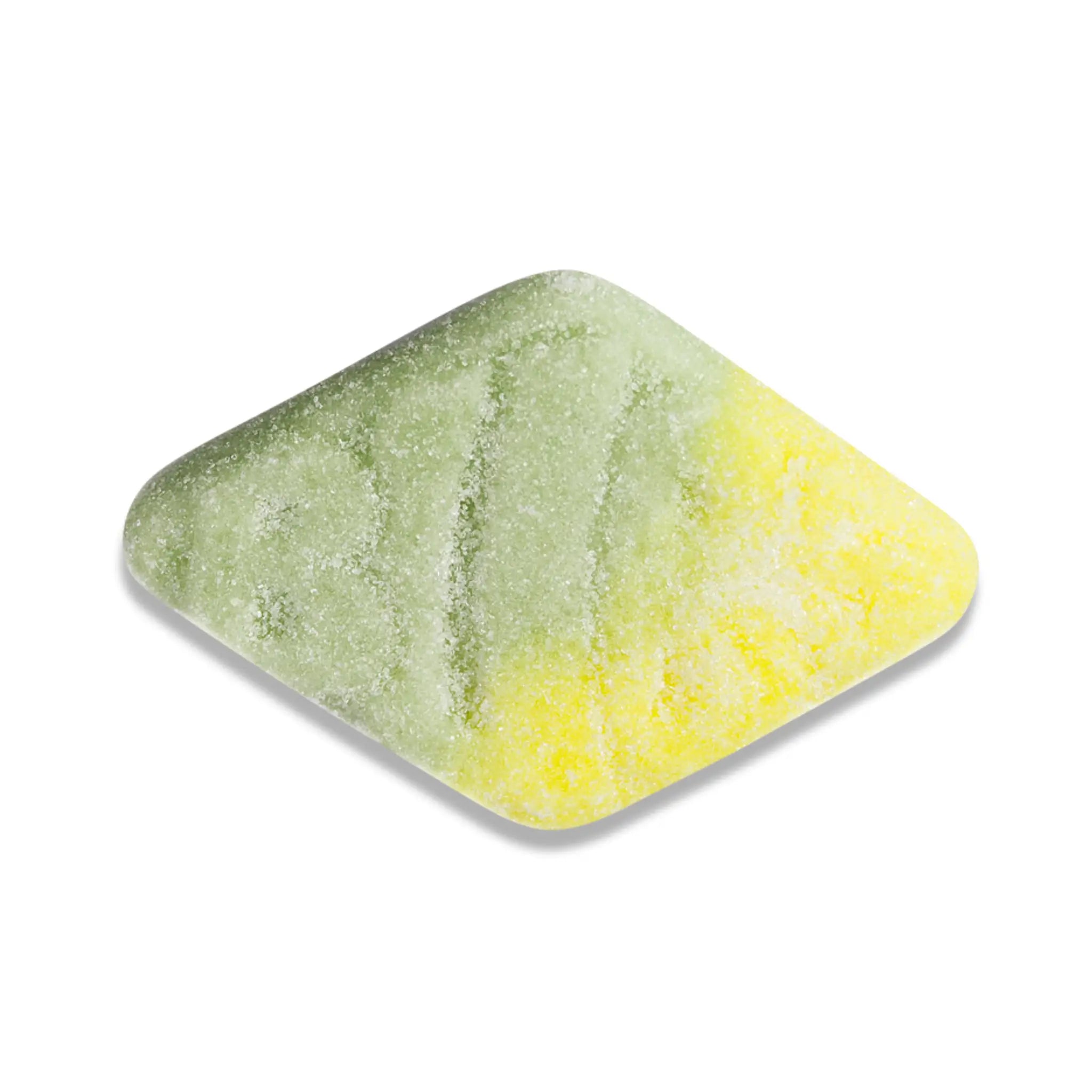 A piece of Swedish candy in the shape of a rhomb, in green and yellow, coated in sugar.
