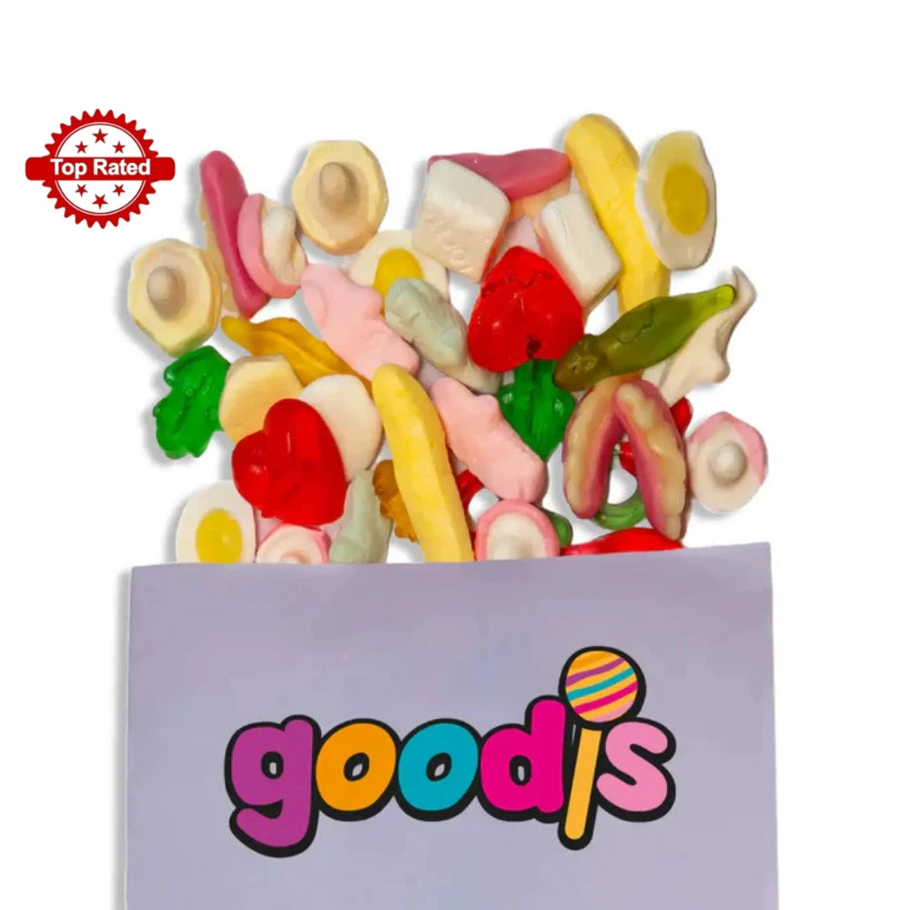 A mix of Swedish candy in different colors and shapes, such as mushrooms, teeth and rats, popping out from a purple candy bag with the logo "Goodis" on it.