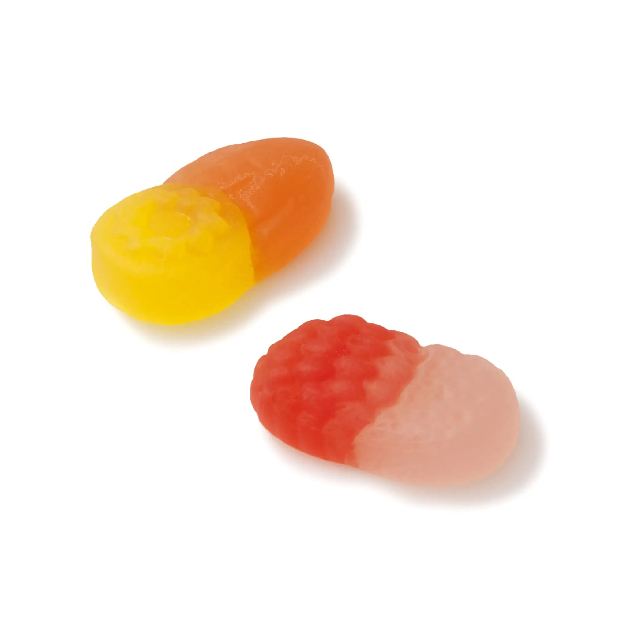 Two pieces of Swedish candy in the shape of little fruits, in pink and red, and in yellow and orange.