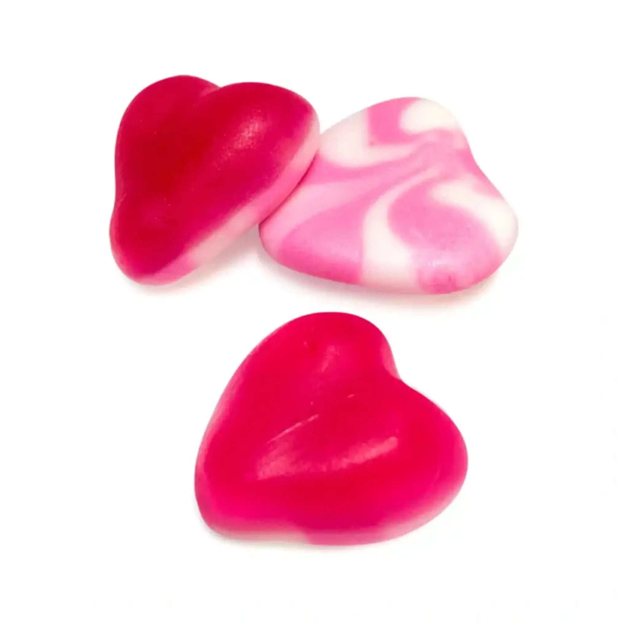 Heart-shaped gummy candies in patterns of pink, white and red.