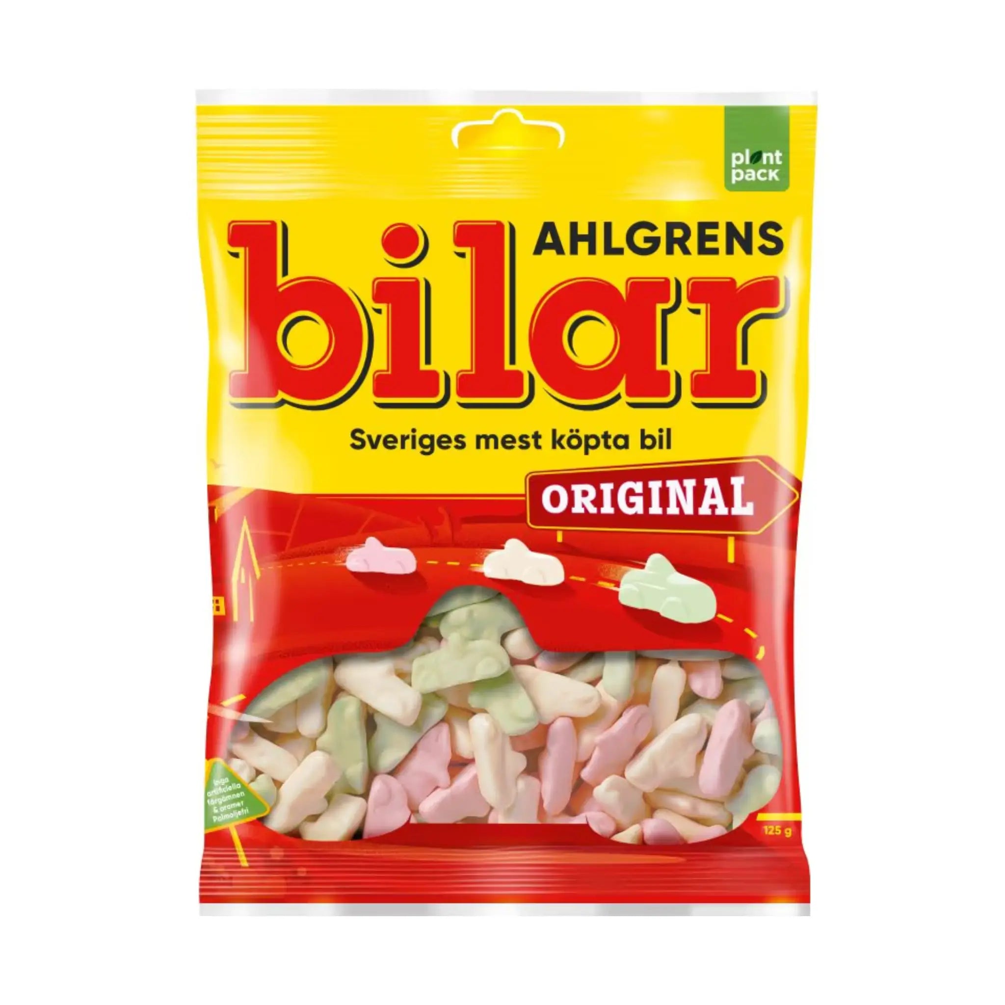 A bag of Ahlgrens Bilar in red and yellow, wrapped around candy pieces in pink, white and green.
