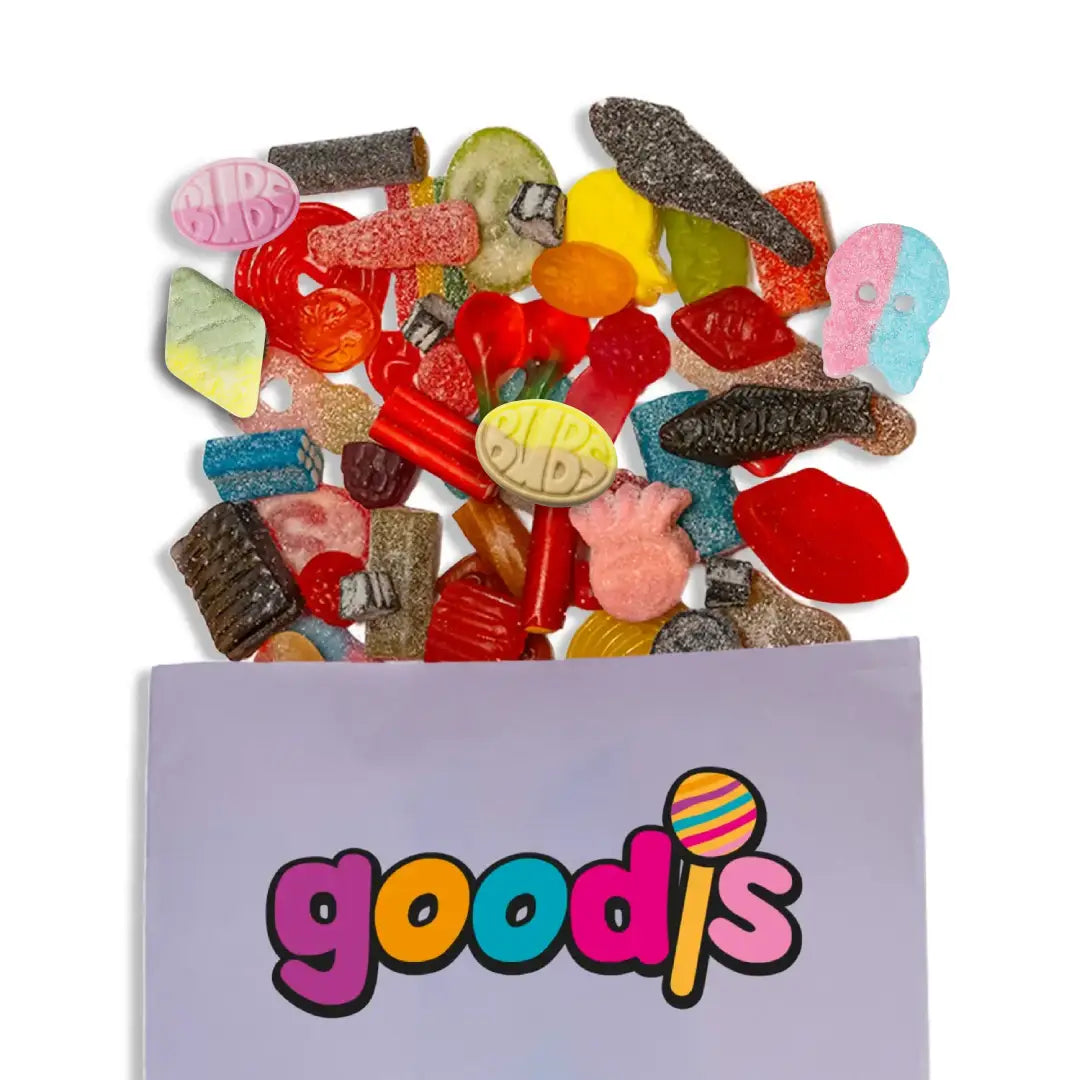 Swedish candy in different colors and shapes, such as Bubs, fishes, bottles and S-patches, falling from a purple bag with the word "Goodis" on it.