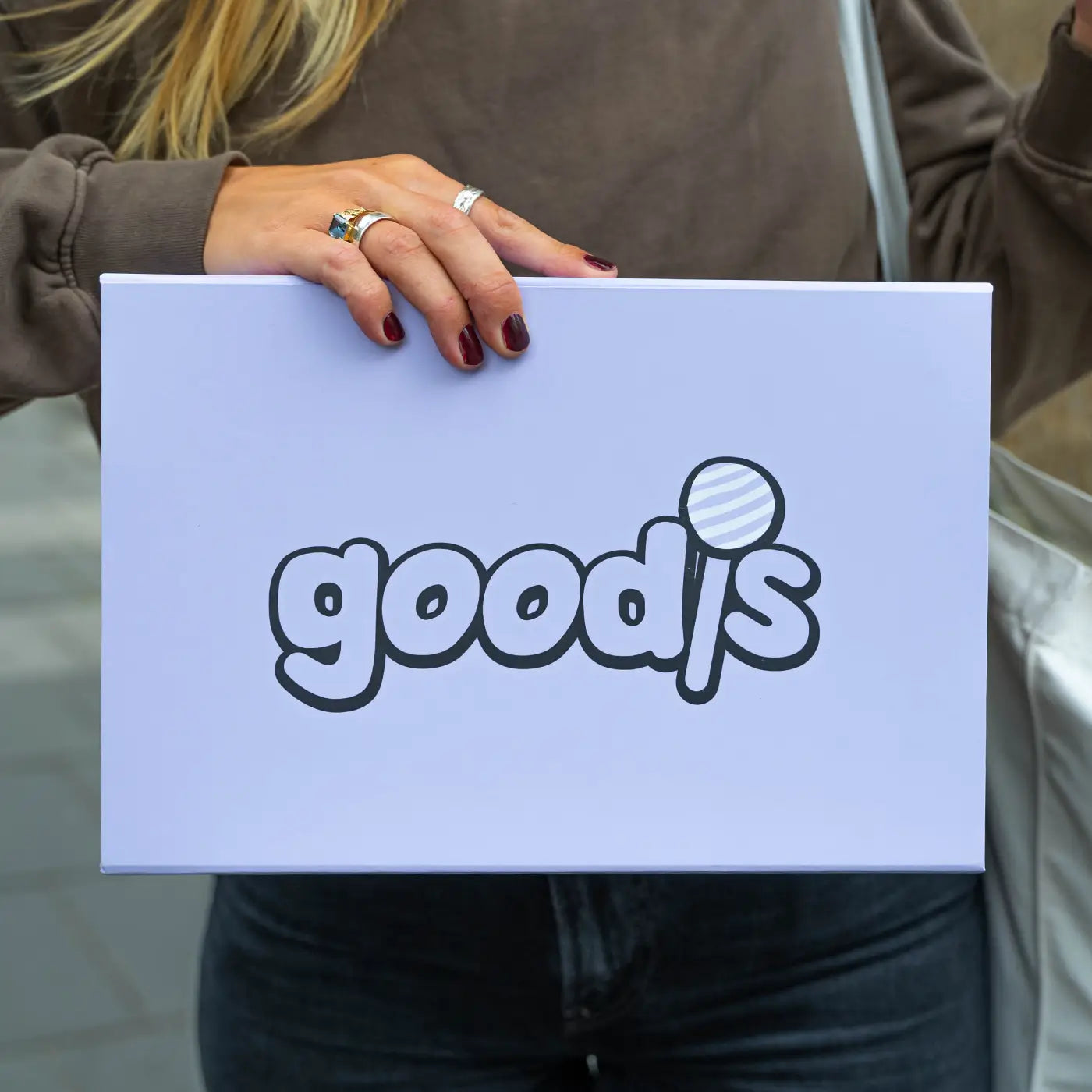 Woman holding a gift box.