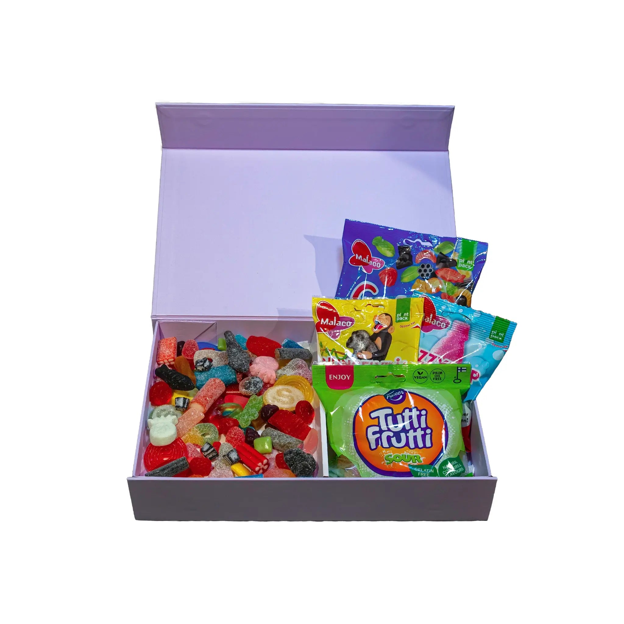 An open purple gift box with different kinds of candy pieces and bags.