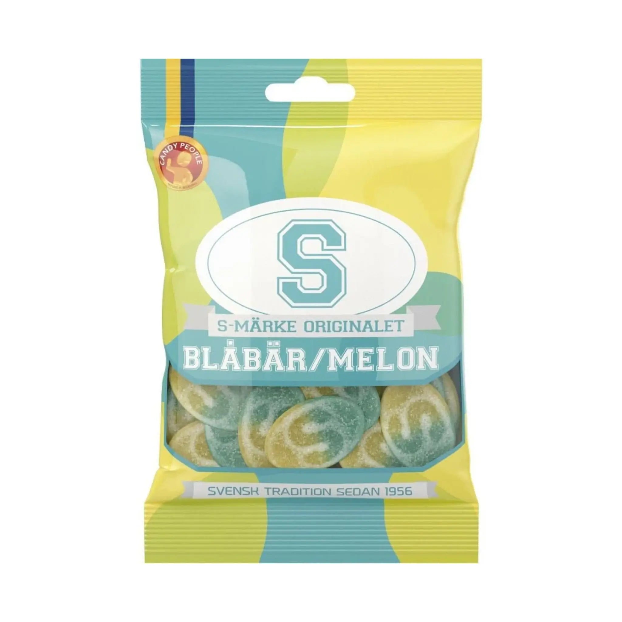 Swedish candy in blue and yellow, in oval shape and with the letter "S" on the front of each one, wrapped in a bag in mainly green, blue and yellow.