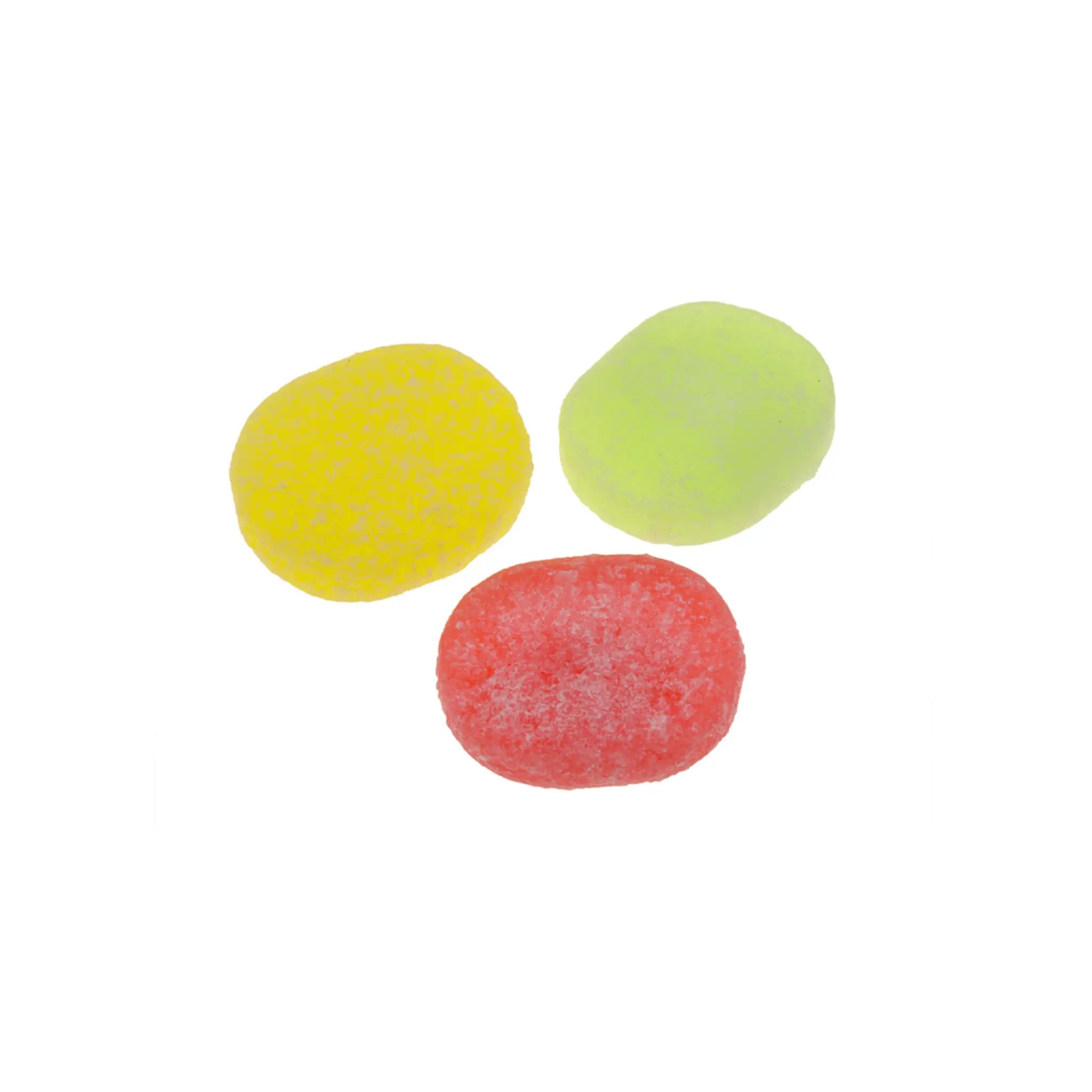 Three pieces of Swedish candy in the shape of circles, in yellow, green and red, coated in sugar.