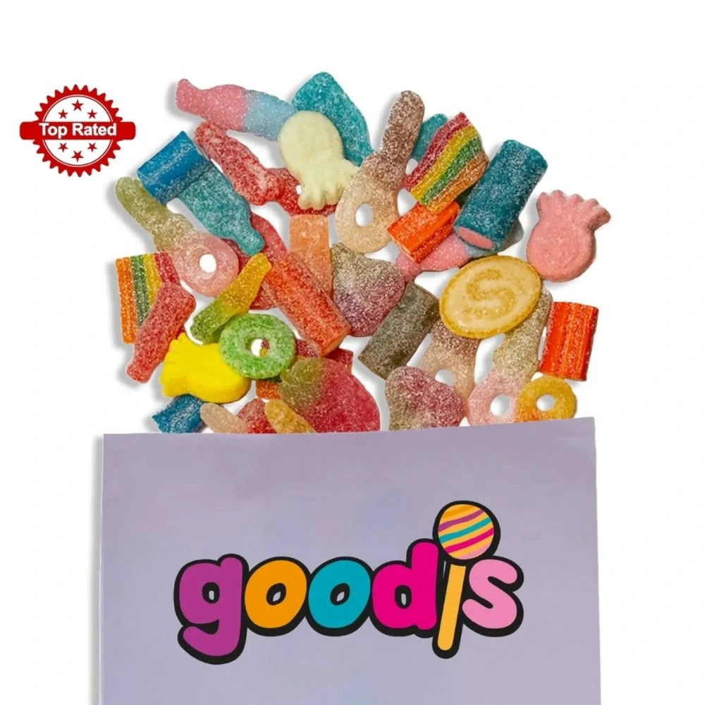 A sour mix of Swedish candy in different colors and shapes, such as pacifiers and rings, popping out from a purple candy bag with the logo "Goodis" on it.
