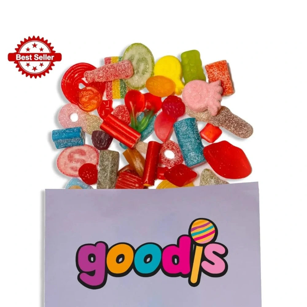 A mix of Swedish candy in different colors and forms, popping out from a purple candy bag with the logo "Goodis" on it.